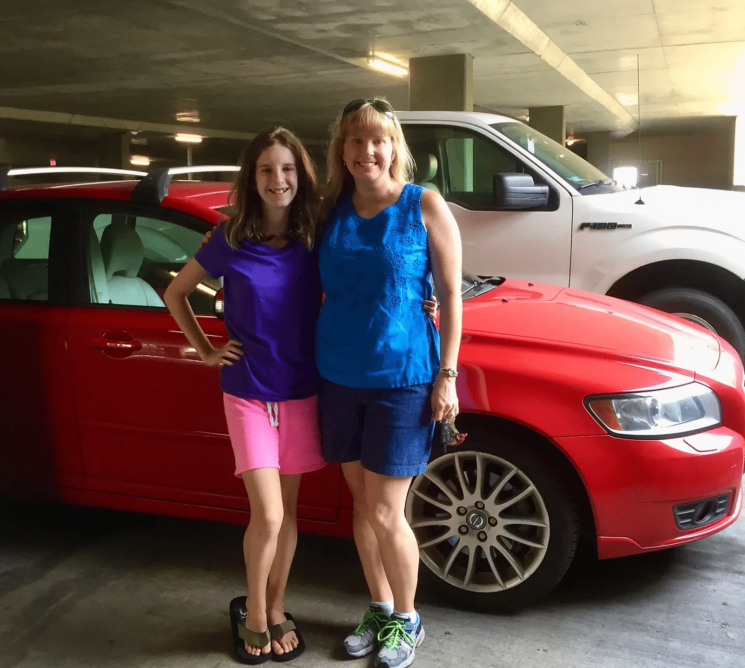 Isabel and I pose in front of Ruby, the red Volvo, before our first cross-country drive from Alabama to Los Angeles, July, 2015.